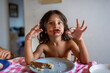 © Nasos Zovoilis/Stocksy - Boy eating breakfast