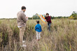 © Studio Firma/Stocksy - Family Playing Outdoors