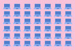 © Gemma can fly/Stocksy - Laptop computers pattern illustration on pink background