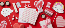 Valentine's Day Accessories On Red Background, Top View