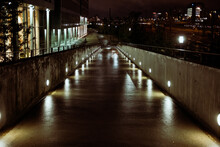 A Wet City Street At Night