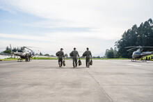 Military Men At Airport Runway Against Sky