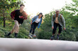 © Santi Nuñez/Stocksy - Portrait of three multiethnic young millennial skating