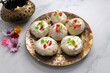 Rasmalai or Malai Sandwich, Roshmolai, Rasamalei is very popular Indian dessert. A sweet malai stuffing inside Rasgulla. It's a sweet delicacy made with Indian cottage cheese or chenna. Copy space.