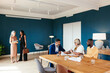 © BONNINSTUDIO/Stocksy - Diverse notaries and clients in office