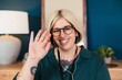 © BONNINSTUDIO/Stocksy - Friendly employee waving hand