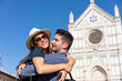 © Westend61 - Couple embracing each other on sunny day with Basilica Of Santa Croce in background