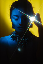 Conceptual Portrait Of A Girl With A Colored Light