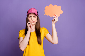 Sticker - Photo of thoughtful young doubtful woman look empty space think hold cloud isolated on purple color background