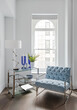 © Neil Perry/Stocksy - Blue chair and side table