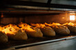 © Sergio Marcos/Stocksy - Crispy loaves baking in oven