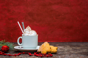 Christmas cookies on red background, cocoa, christmas tree and christmas 
 toys. Trend photo in two planes