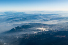 Aerial View Of Mountains Shrouded In Fog