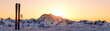 Skis and poles dug into the snow on a mountainside at sunrise 3d render panoramic