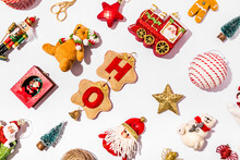 Collection Of Various Christmas Decorations Flat Laid Against White Background