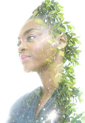 A portrait of a woman combined with green foliage. Paintography.