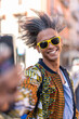 © MandriaPix - handsome young man using smartphone for a selfie, casual and street wear, cool attitude, afro american mixed race people