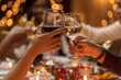 © Syda Productions - holidays, drinks and celebration concept - close up of hands toasting wine glasses at dinner party on christmas at home
