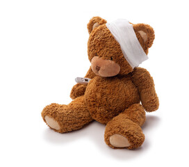 Wall Mural - medicine, healthcare and childhood concept - teddy bear toy with bandaged head and thermometer on white background