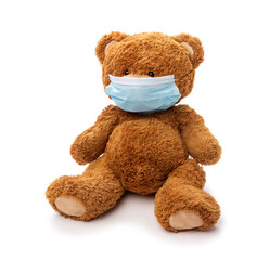 Wall Mural - medicine, healthcare and pandemic concept - teddy bear toy in protective medical mask on white background