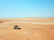 © Westend61 - Mauritania, Banc dArguin National Park, Aerial view of off road car driving through desert