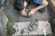 © andranik123 - Man repairs car alternator. Technology. Industry