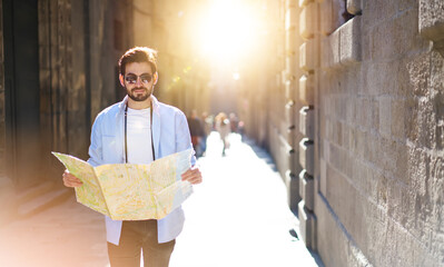 Wall Mural - Man searching for road on map