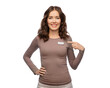 sale, shopping and business concept - happy female shop assistant showing her name tag over white background