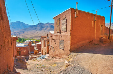 Sticker - The steep descent with bad mud road due to the often landfalls in historic Abyaneh village, Iran.