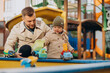 © Petro - Father with baby son on play ground having fun