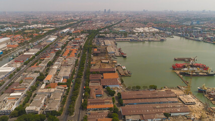 Wall Mural - aerial view cargo and passenger seaport with ships and crane Tanjung Perak, surabaya, indonesia. docks for the repair and parking of ships, cargo port and container terminal. ship in industrial port