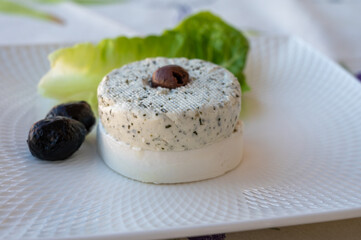 Cheese collection, French soft white goat cheese with herbs of Provence and olives