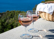 Picnic with of local rose wine and blue Mediterranean sea on background, near Saint-Tropez, Var, Provence, France
