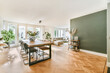 © Casa imágenes - Stylish living room with a large comfortable sofa combined with a dining room