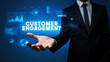 © ra2 studio - Hand of Businessman holding motivational message