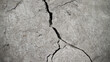© Artskrin - Vertical concrete crack on a rough texture. Retro effect of aging and destruction.