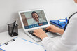 © Pixel-Shot - Doctor video chatting with patient in clinic. Concept of telemedicine
