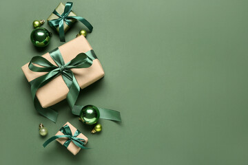 christmas gifts and decorations on green background