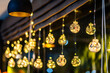 © Thinapob - Christmas decoration lights in the shape of a star for with rope on Bokeh background Decoration During Christmas and New Year.