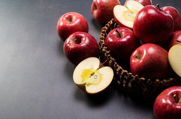 Wall Mural - A lot of apples on a black background.