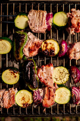 Poster - Close up of delicious pork on wooden skew with fresh vegetables