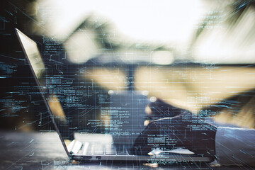 Wall Mural - Close up of businessman hands using laptop with creative glowing coding big data interface on blurry outdoor background. Technology and futuristic network. Double exposure.