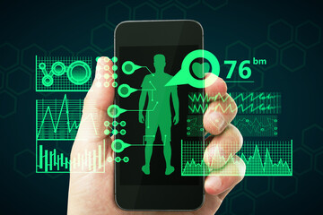 Wall Mural - Close up of businessman hand holding smartphone with creative medical interface on dark background. Online medicine and healthcare concept.