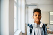 © Drazen - Portrait of black elementary student in classroom looks at camera.