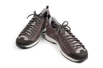 Men's gray-brown sports shoes laced with laces. Close-up shot.