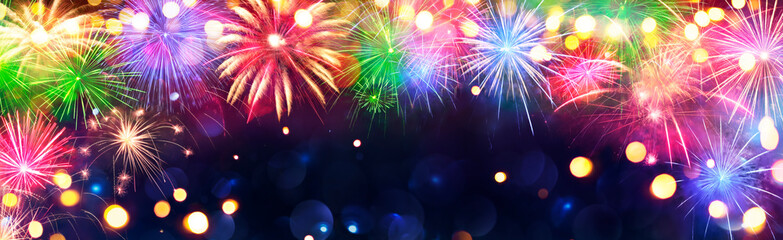 Wall Mural - fireworks - anniversary celebration with colorful lights in blue night with glittering - abstract de