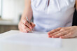 © Westend61 - Businesswoman signing contract at office