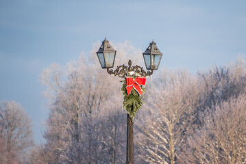  Lantern with Christmas decoration on a sunny winter day