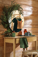 Canvas Print - Stylish dressing table and mirror decorated with green eucalyptus in room