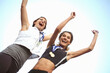 © Westend61 - Happy female athles wearing medals celebrating success